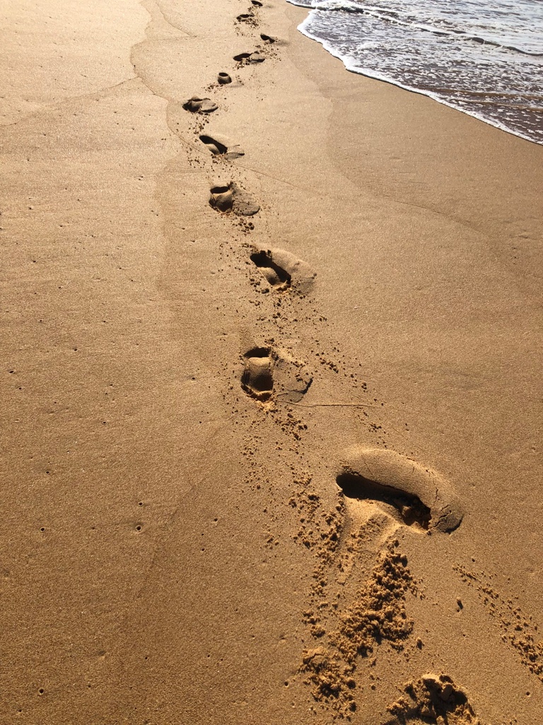 Footprints by the beach